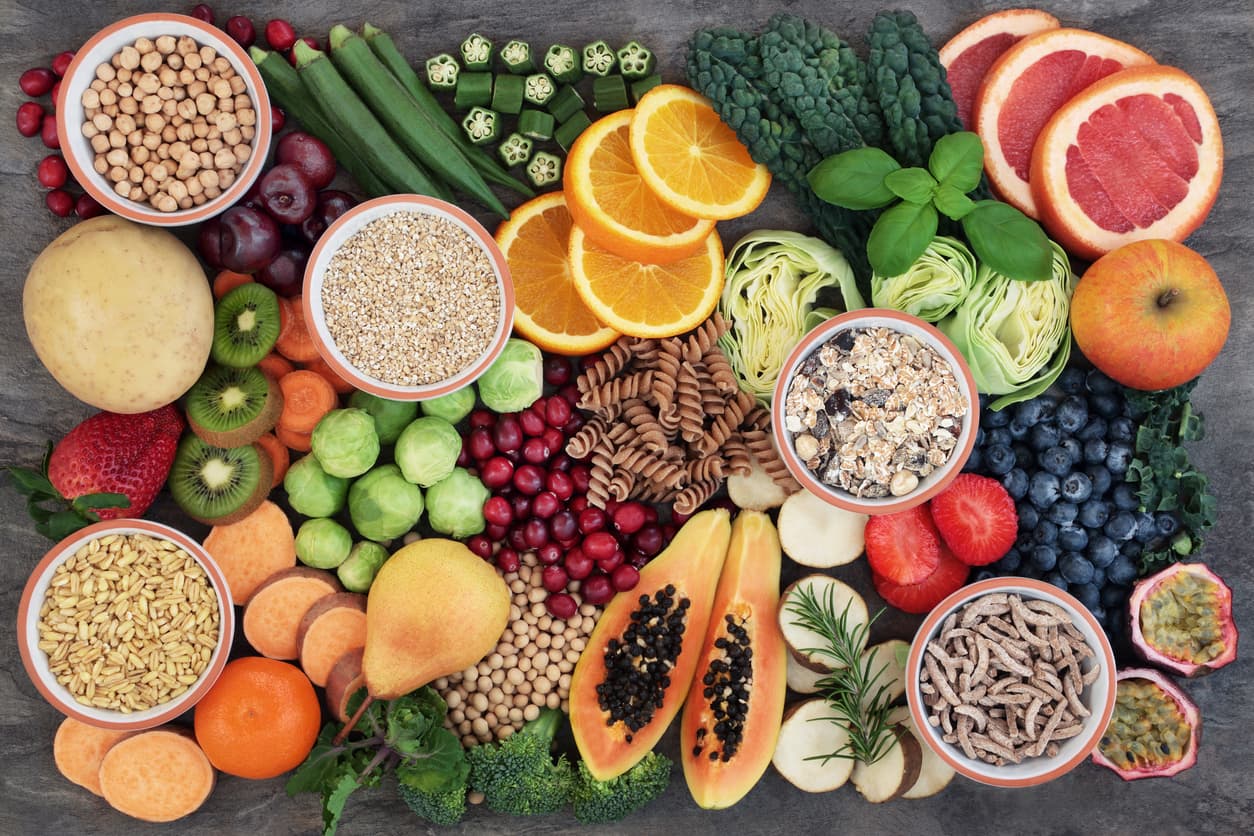 A colorful assortment of whole grains, legumes, fruits, and vegetables