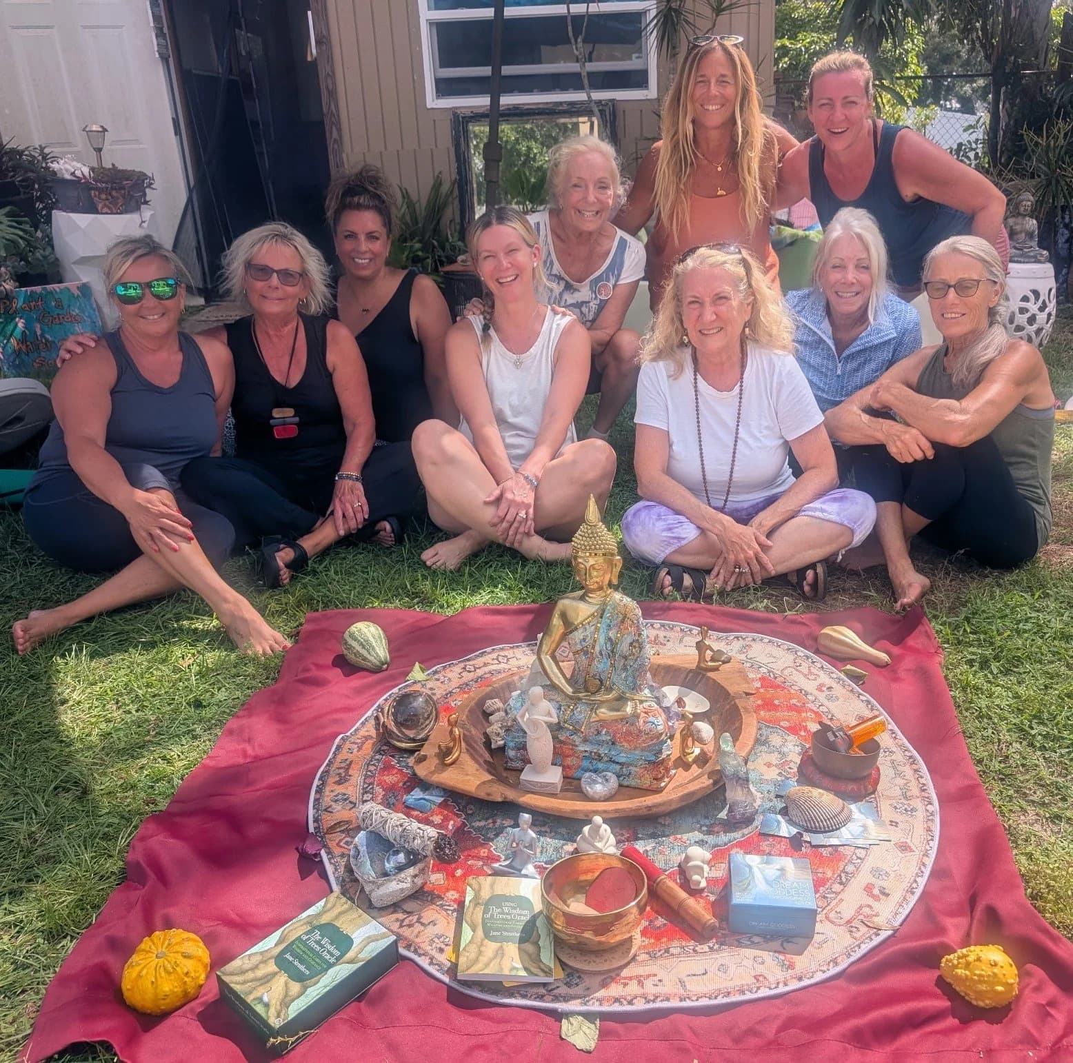 Love Yourself retreat participants gathered around a ceremonial display